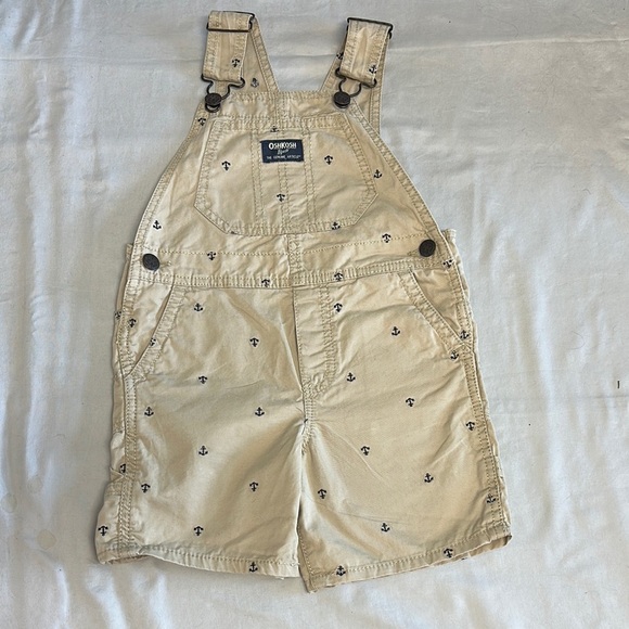 OshKosh B'gosh Tan Overall shorts w/ anchor design & adjustable shoulder straps - Picture 1 of 5
